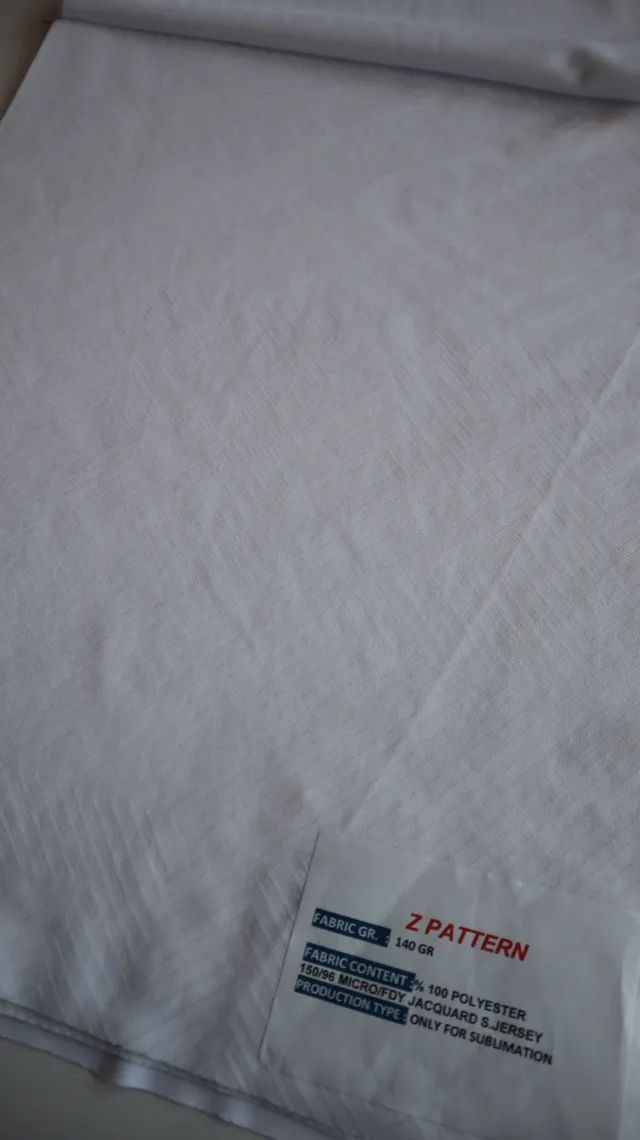 Performance sportswear fabric construction close-up showing knit surface and stretch — 4