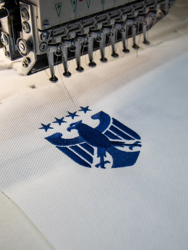 Custom logo applied to sportswear — 3D embroidery, flat embroidery and UV DTF — 3