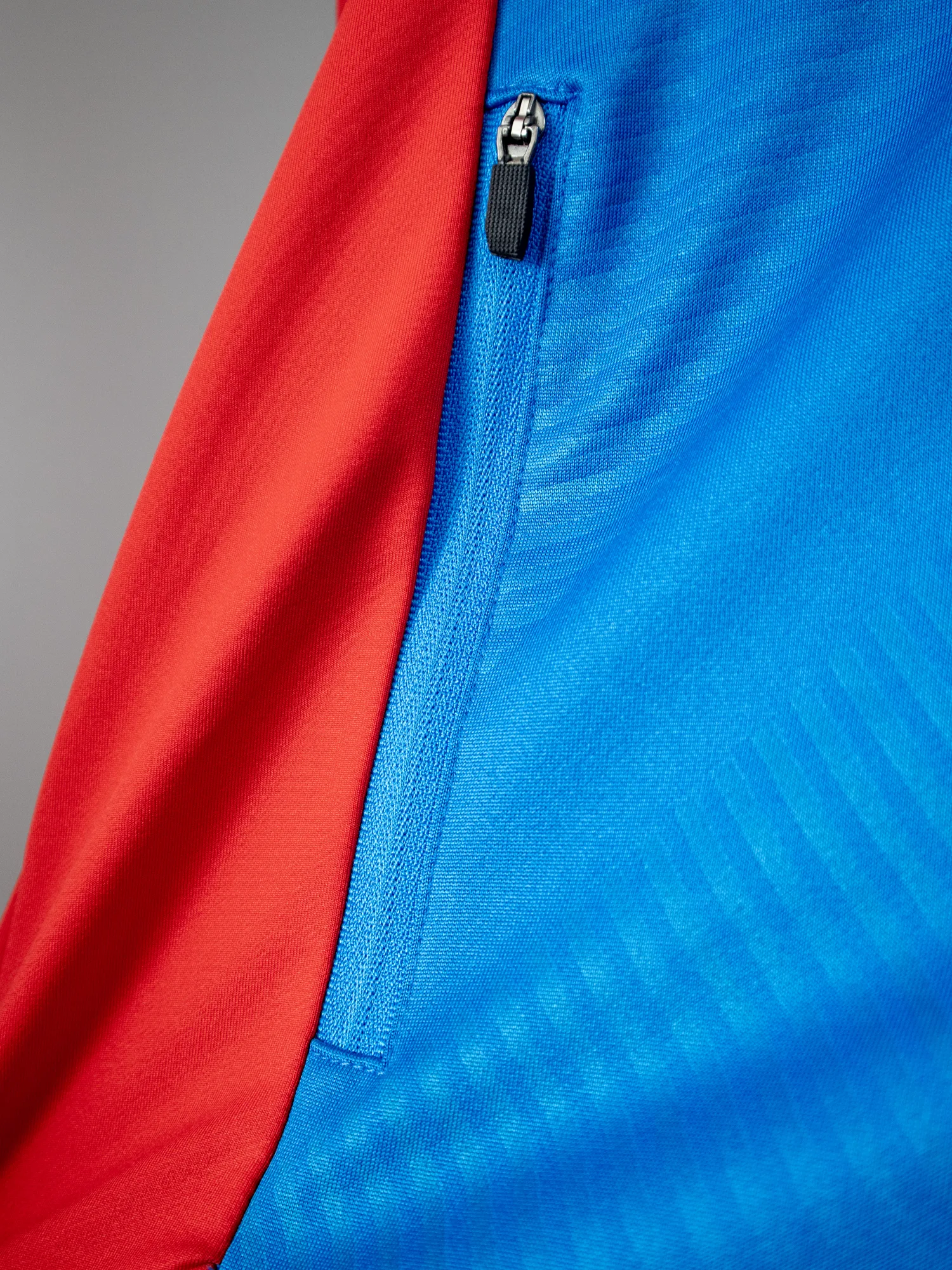 Flatlock stitching quality close-up on a custom-manufactured sports garment