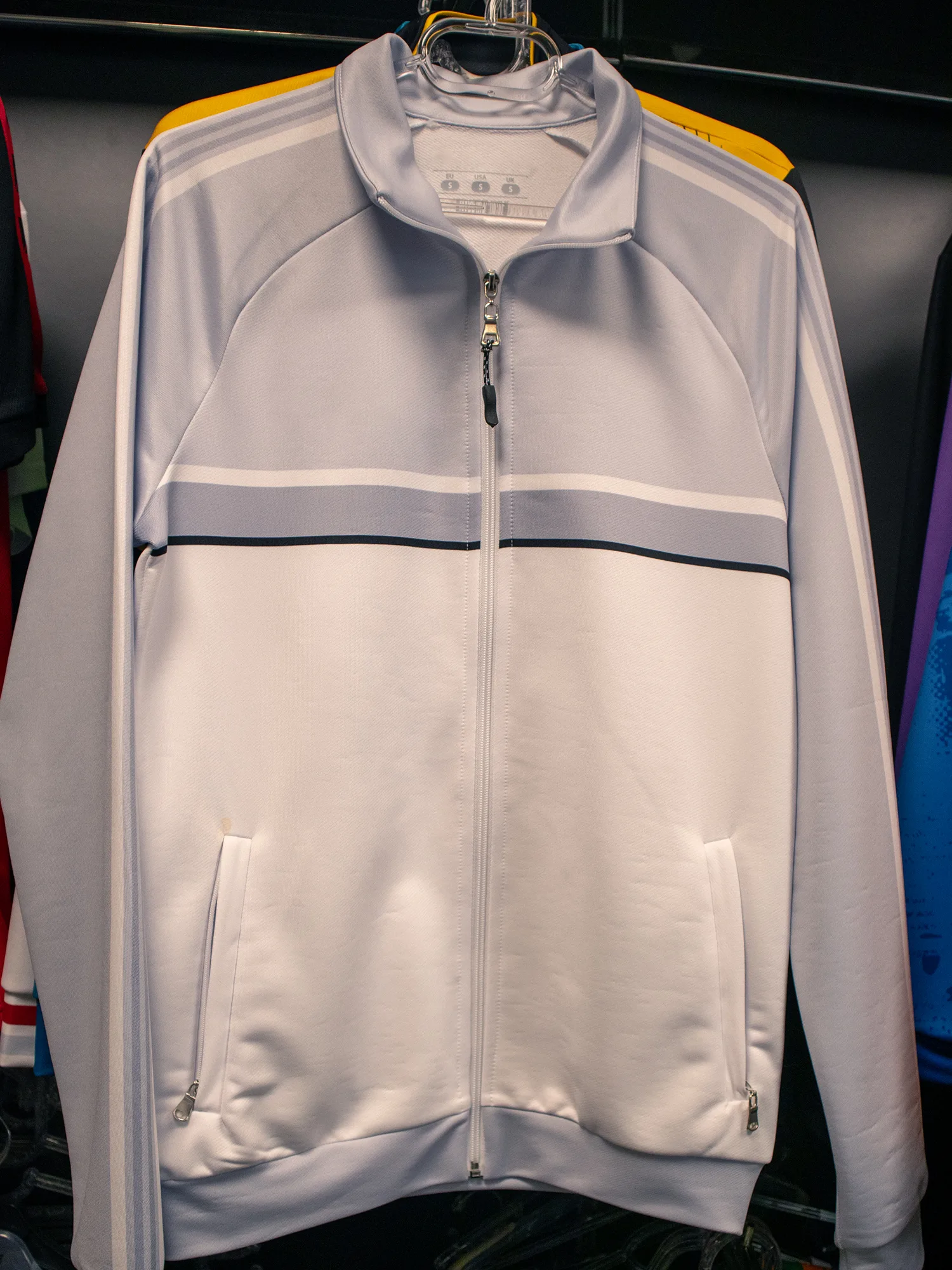 Custom white-label tracksuit top and pants manufactured for a sportswear brand
