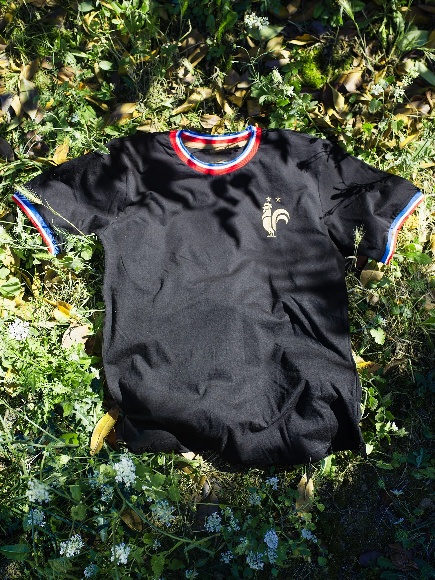 Custom white-label t-shirt with embroidery and DTF print produced under a private label
